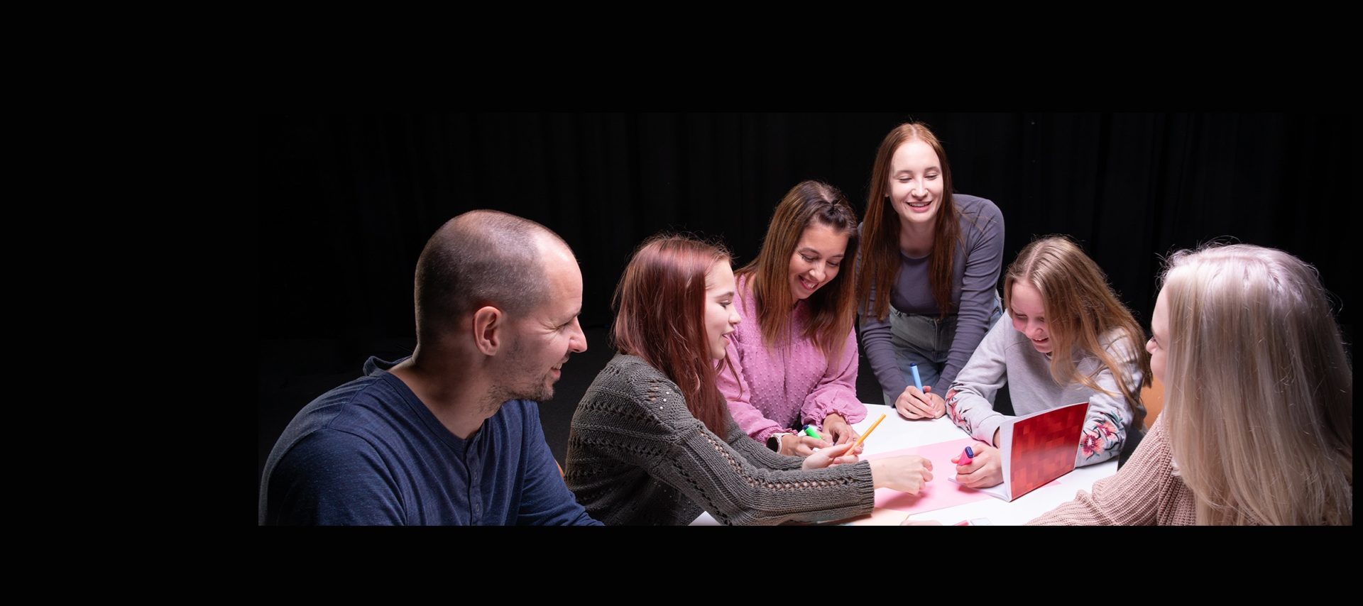 People around the table are planning together.